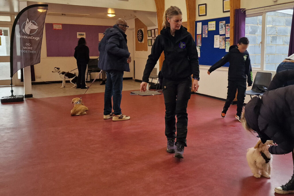 Photograph of Lisa from Nimbus Dogs teaching a loose lead walking dog training class